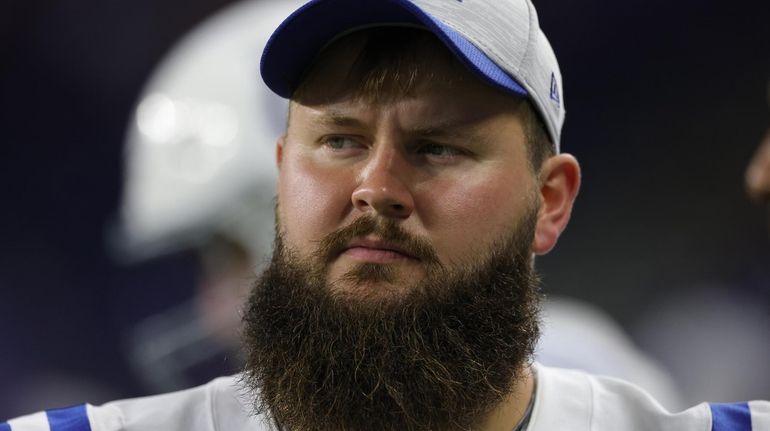 Mark Glowinski #64 of the Indianapolis Colts watches the action...