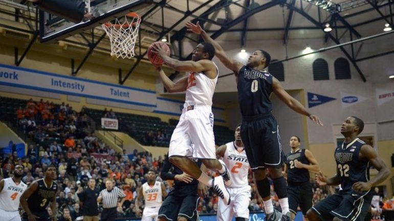 Oklahoma State's Markel Brown (22) goes up for a shot...