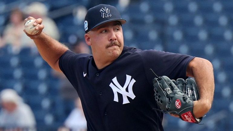 Yankees pitcher Greg Weissert throws batting practice during spring training...