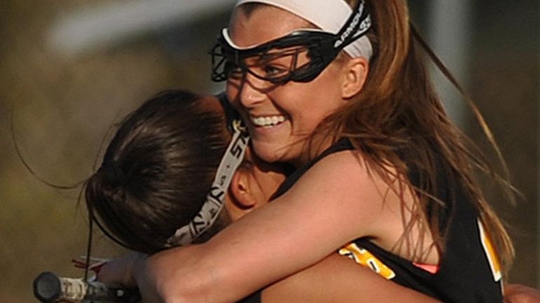 Wantagh's Taylor Rossi, left, hugs Nikki Sliwak, who scored with...