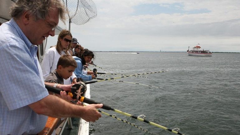 Customers fishing aboard the Island Princess Charter Fishing Boat out...