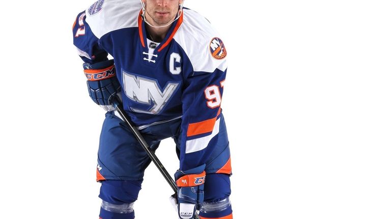 John Tavares models the jersey the New York Islanders will...