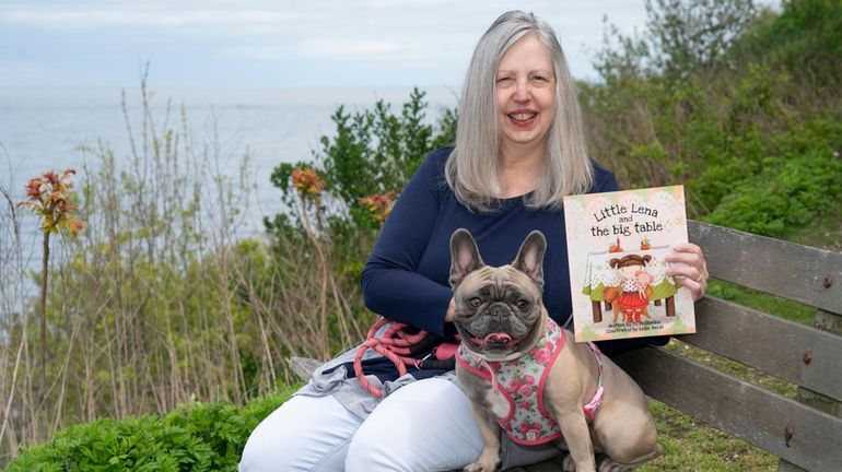 P.J. McIlvaine holds her book, "Little Lena and the Big...