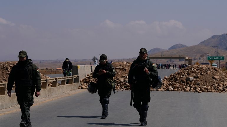 Police patrol at a roadblock in Vilaque on the outskirts...