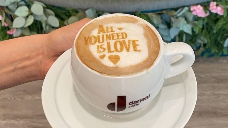 A caramel cappuccino with a custom art design at Sugar...