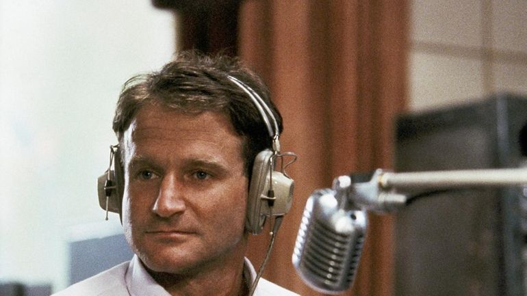 Robin Williams as disc jockey Adrian Cronauer in director Barry...