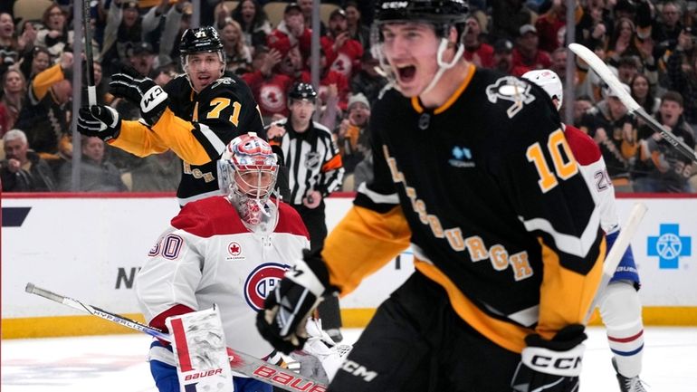 Pittsburgh Penguins' Drew O'Connor (10) begins to celebrate his goal...