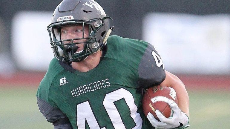 Westhampton Beach's Dylan Laube runs for a big gain in...