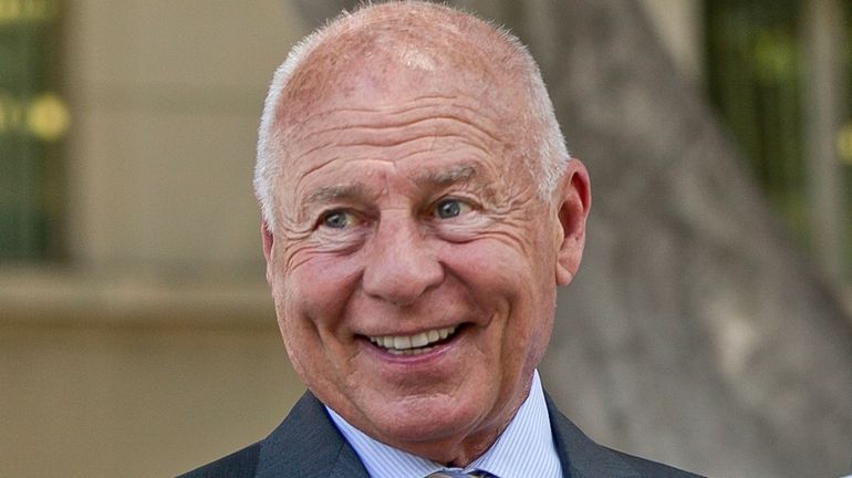 Attorney Tom Girardi smiles outside the Los Angeles courthouse, July...