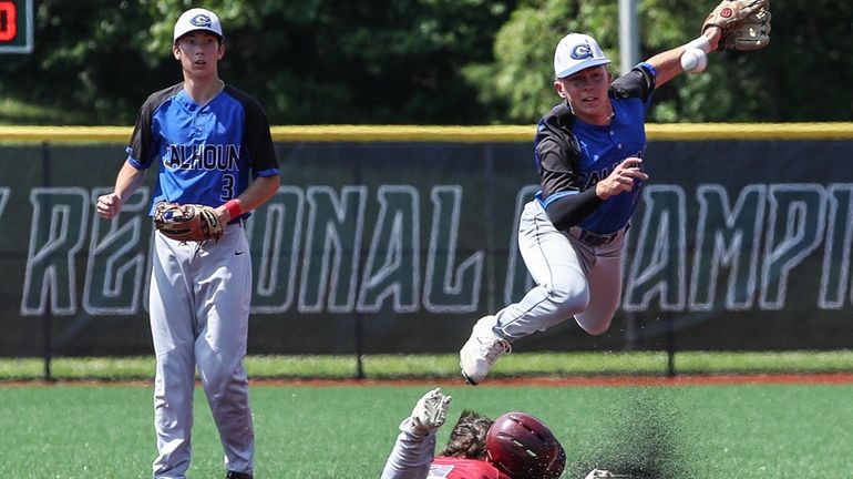 Calhoun's Andrew Schneir turns the double play during game two...