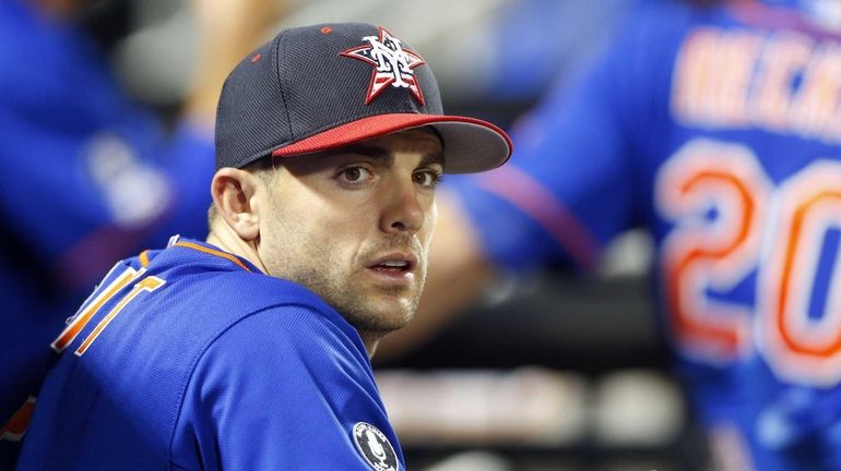 David Wright of the Mets looks on during the sixth...