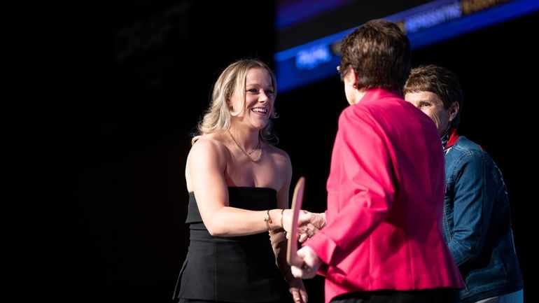 No. 1 overall draft pick Sarah Fillier, left, who was...