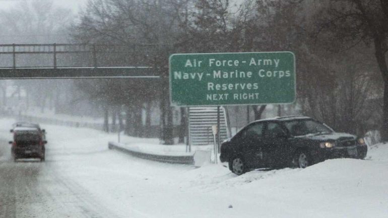 A car faces the opposite direction on the side of...