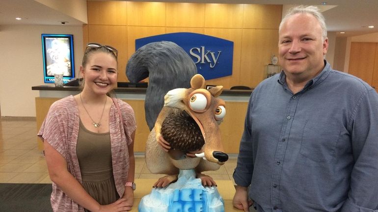 Glen Cove High School senior Julia Farley with Tom Cardone,...