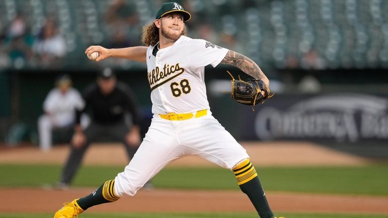 Oakland Athletics pitcher Joey Estes works against the Seattle Mariners...