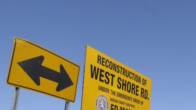 Signs direct traffic through the intersection of Cleft Road and...