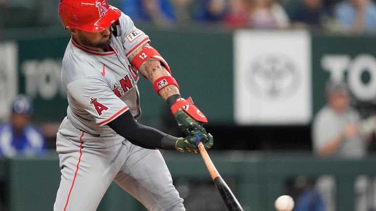 Los Angeles Angels' Kevin Pillar singles on a line drive...