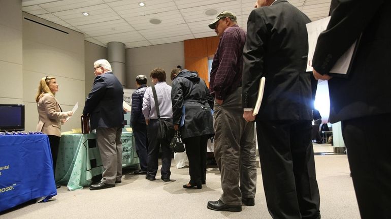 Job-seekers at a job fair in the Newsday auditorium in...