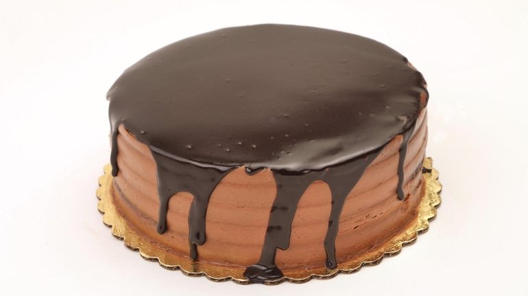 A chocolate ganache cake is one of the specialties from...