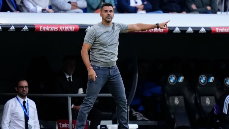 Girona's head coach Michel signals during a Spanish La Liga...