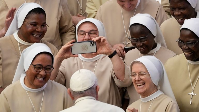 Pope Francis meets a group of nuns during his weekly...