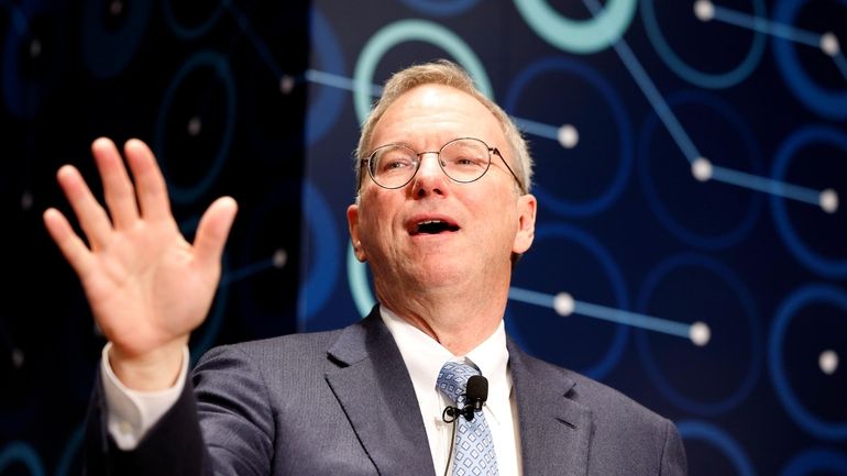 Eric Schmidt, executive chairman of Alphabet speaks during a press...