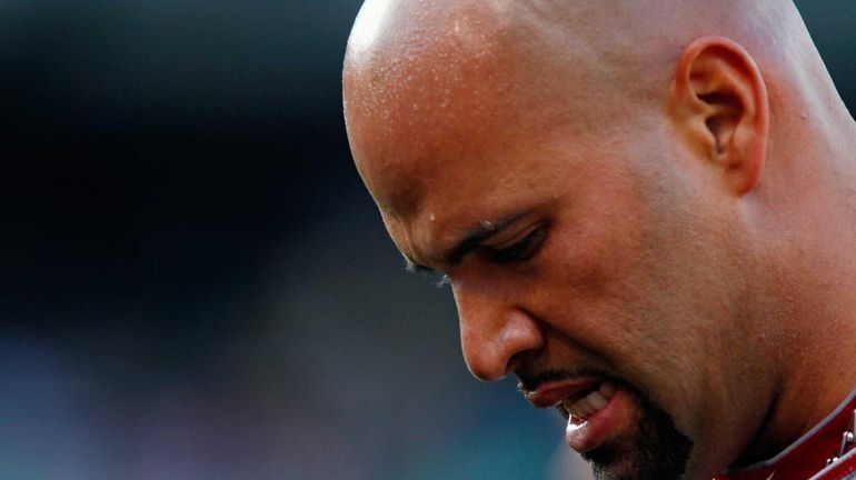 Los Angeles Angels first baseman Albert Pujols warms up before...