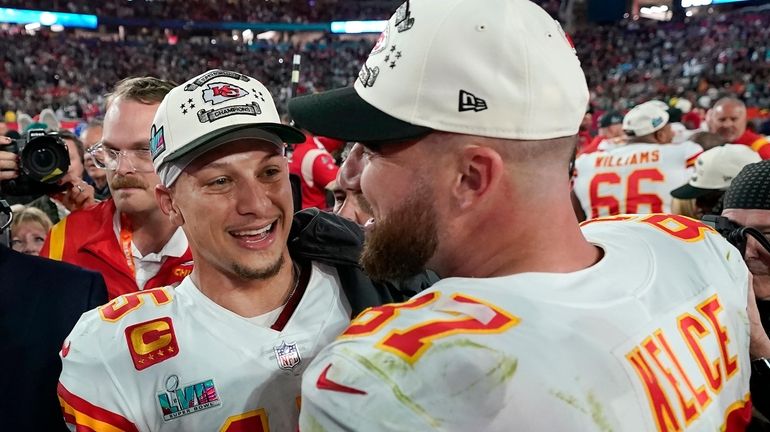 Kansas City quarterback Patrick Mahomes, left, and tight end Travis...