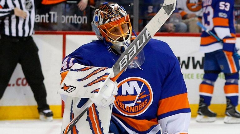 Jaroslav Halak of the Islanders reacts after allowing a second-period...
