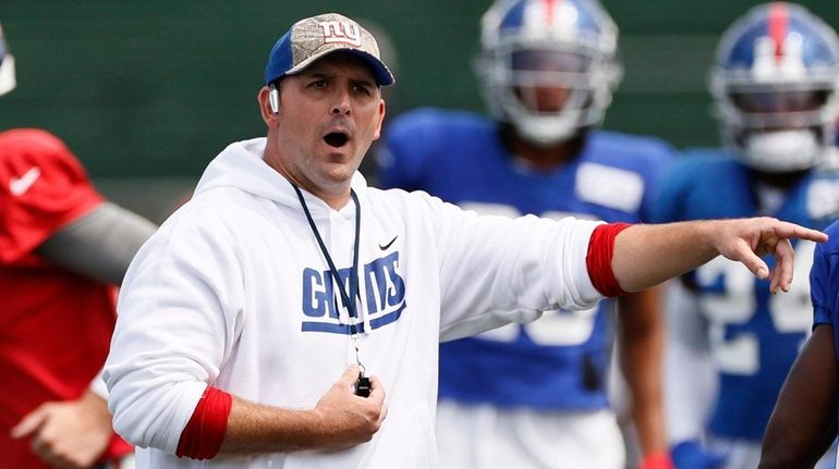 Giants head coach Joe Judge directs his team during a...