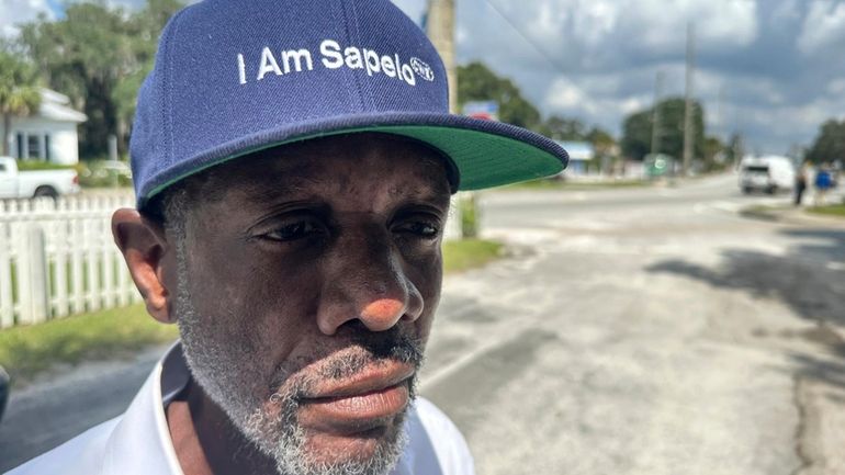 Jazz Watts, a resident of Sapelo Island, wears a hat...