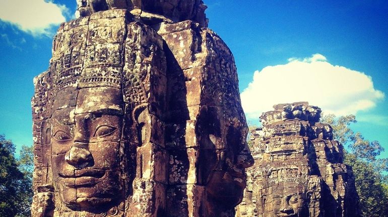 Bayon is a temple of Angkor that many tourists in...