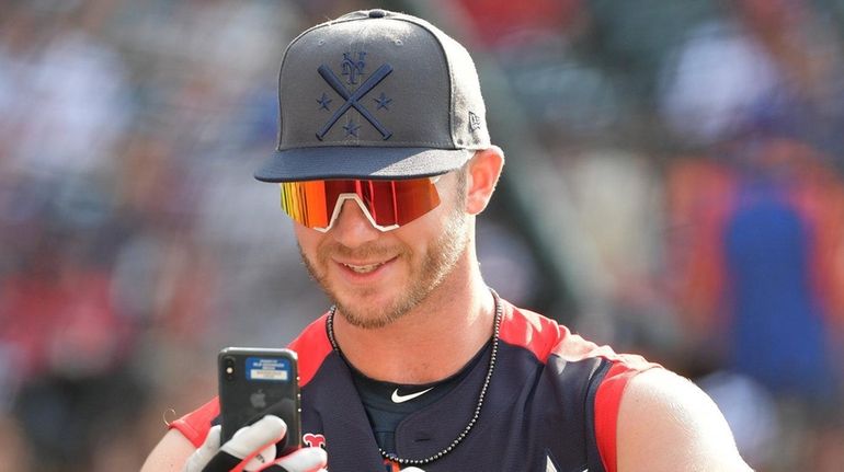 Mets first baseman Pete Alonso takes a selfie before the...