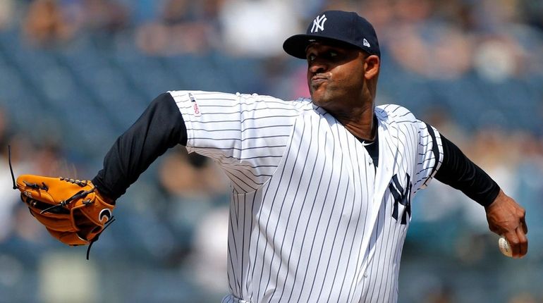 CC Sabathia of the Yankees pitches during the first inning against...