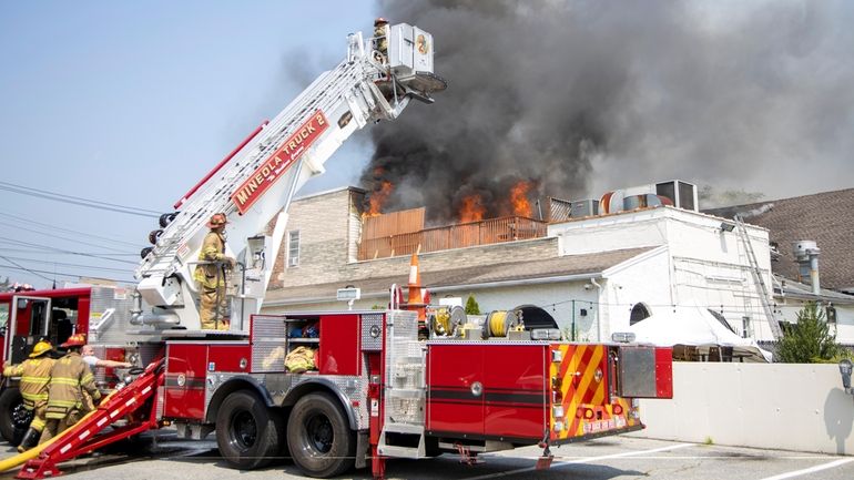 Firefighters at the 2020 blaze at Piccola Bussola in Mineola, a restaurant...