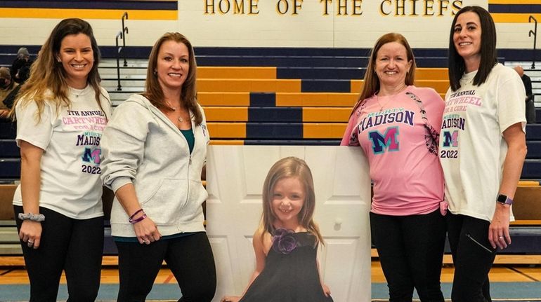 From left, Massapequa coach Katie Meehan, Kristen Milio (mother of...