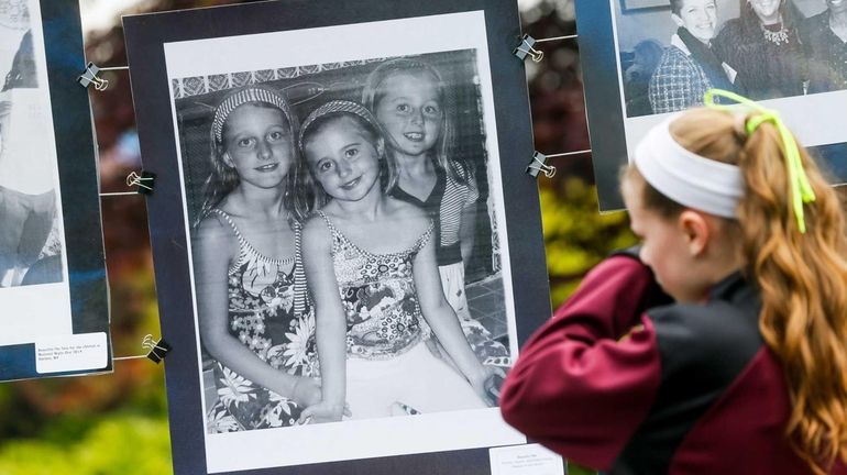 Photos and letters are on display at the 5K family...