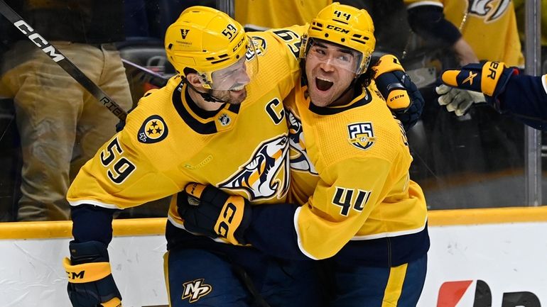 Nashville Predators defenseman Roman Josi (59) celebrates with left wing...