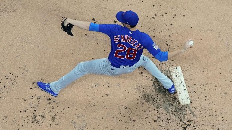 Chicago Cubs starting pitcher Kyle Hendricks throws during the first...