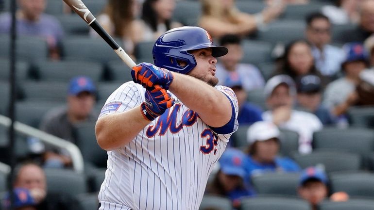 Daniel Vogelbach #32 of the New York Mets follows through...