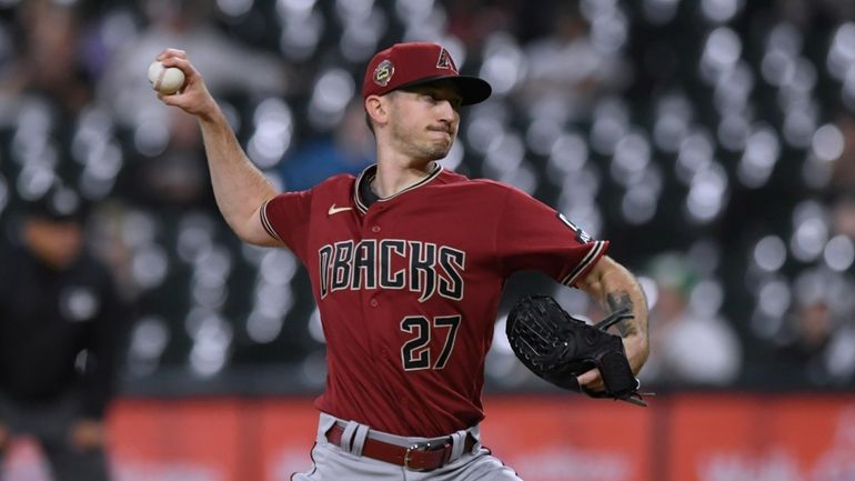 Arizona Diamondbacks starter Zach Davies delivers a pitch during the...