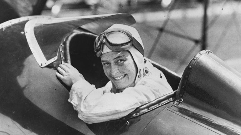 Alicia Patterson at the stick of her Laird biplane in...