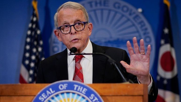 Ohio Gov. Mike DeWine speaks during a news conference, Friday,...