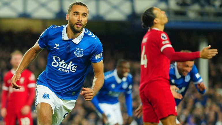 Everton's Dominic Calvert-Lewin, left, celebrates after scoring his side's second...