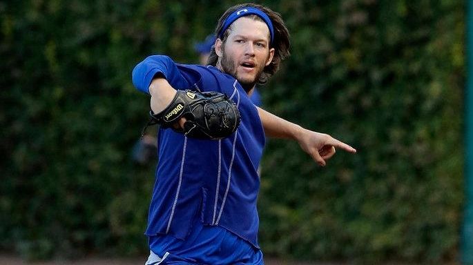 Los Angeles Dodgers' Clayton Kershaw warms up during the team...