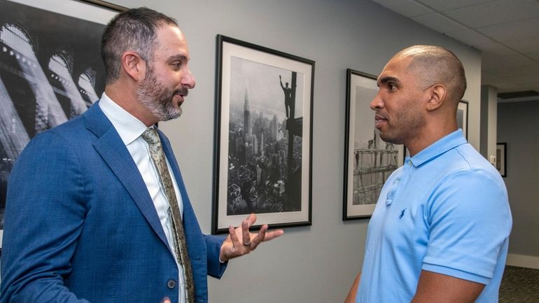 From left, attorney Andrew Lieb with his client, Julio Germain,...