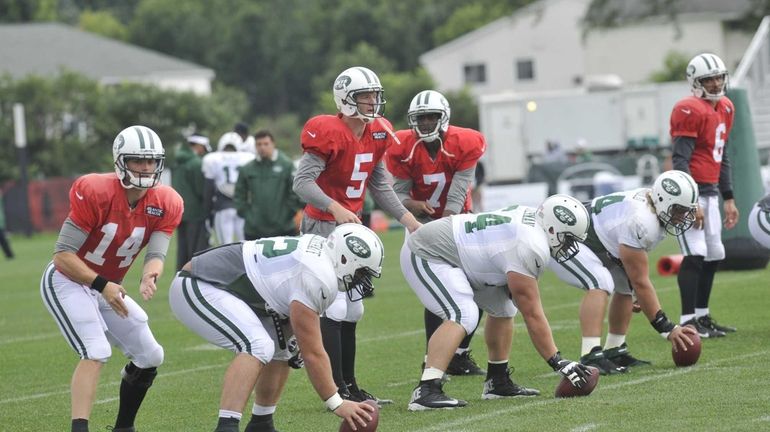 From left, Jets quarterbacks Greg McElroy, Matt Simms, Geno Smith,...