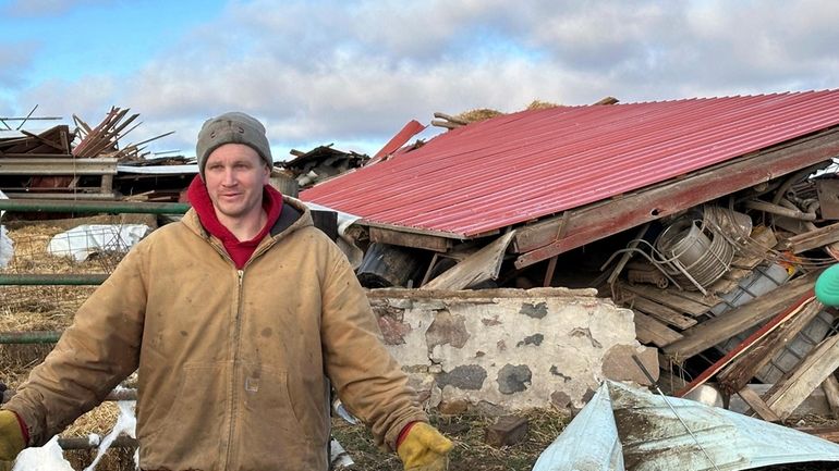 Matt Artis, 34, surveys the wreckage Friday morning, Feb. 9,...