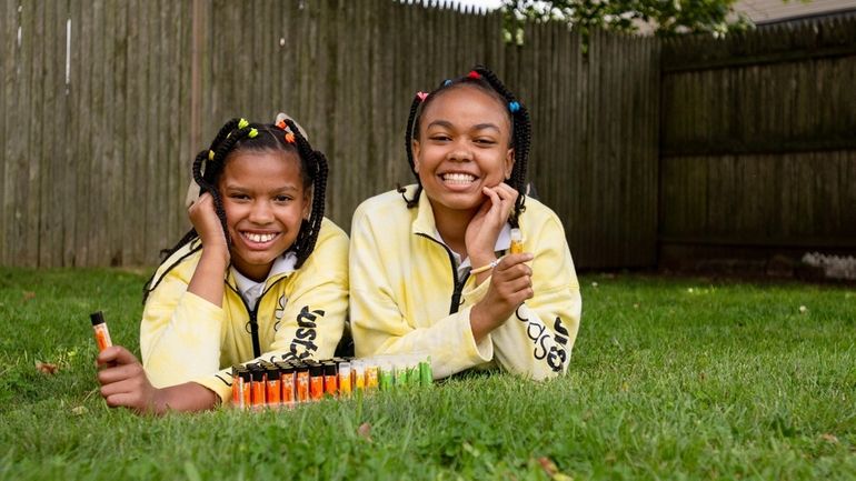 Kiya Henry, 11, and Nia Henry, 12, with the lip...