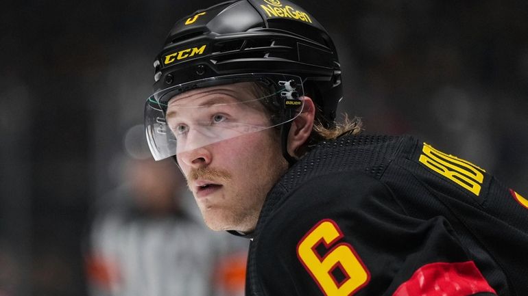 Vancouver Canucks' Brock Boeser waits for a faceoff during the...